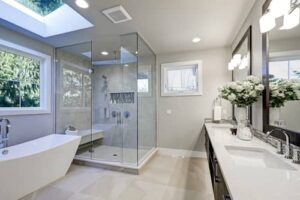 bathroom with wall lighting above the mirror