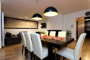 Dining room lighting with pendant lights over the table creating ambience