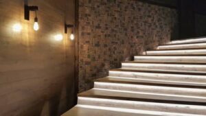 stairwell lighting with bulb style black wall lights for ambient illumination